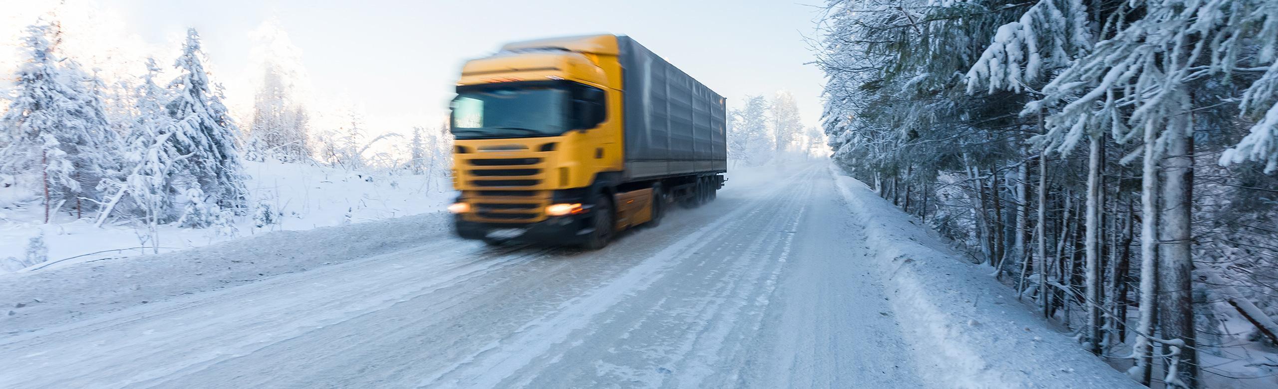 extreme weather transport anti-slip mats, truck driving on snowy road