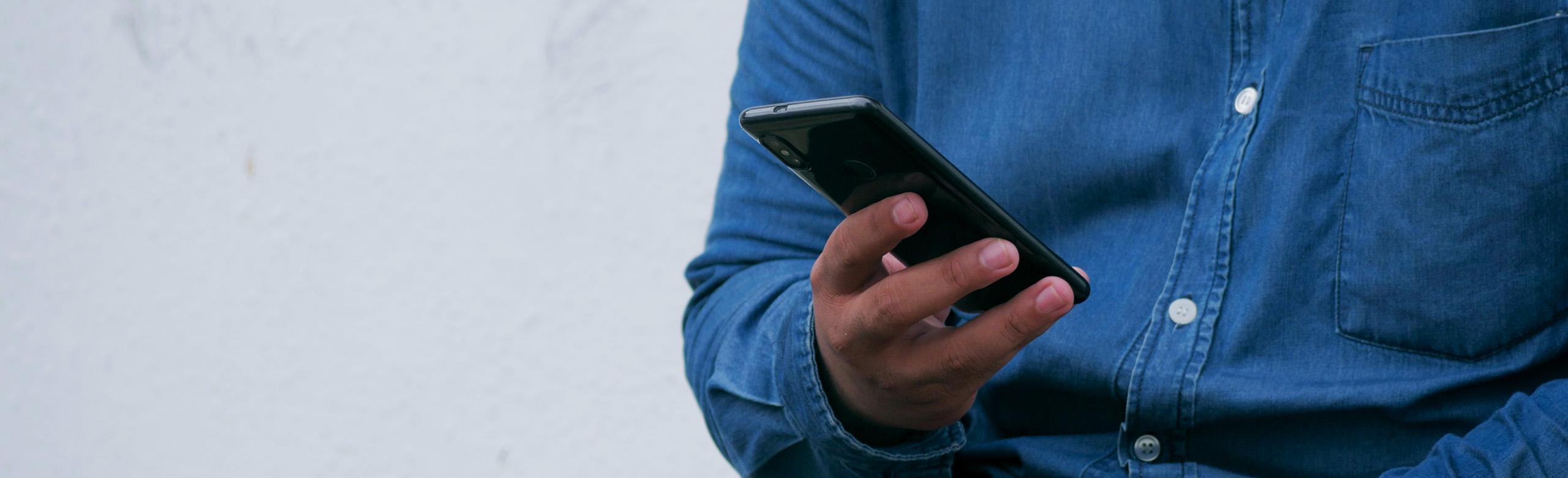 load mats, friction matting, person holding smartphone